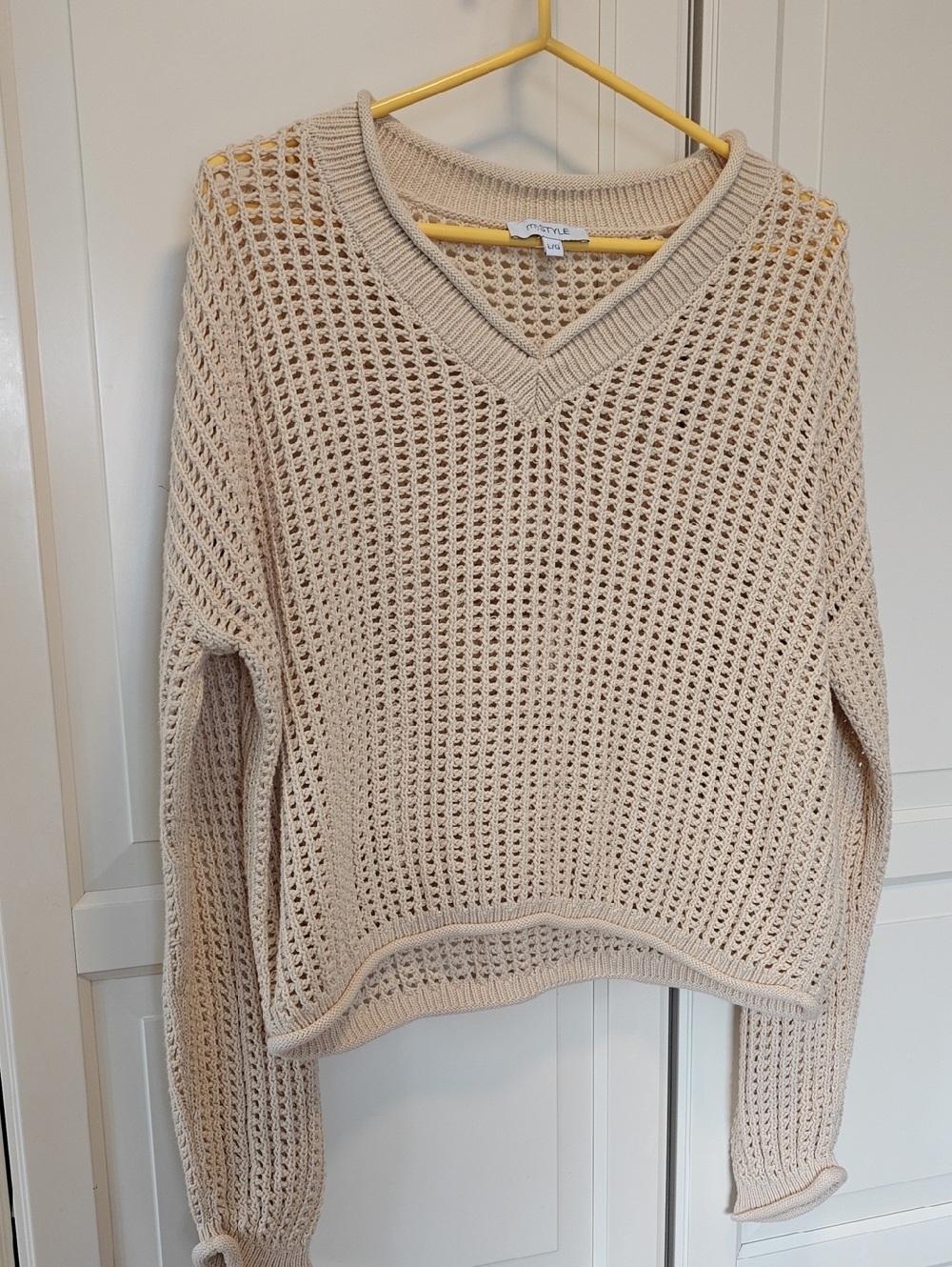 Open-Knit V-Neck Sweater in Cream from Aritzia-style